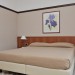 Фото номеров: Двухместный с двуспальной кроватью Economy с боковым видом на море с балконом
