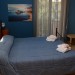 Zdjęcia Pokoi: Dwuosobowy z łóżkiem małżeńskim typu Junior Suite z widokiem na Morze z balkonem